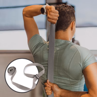 Stretching with a yoga strap