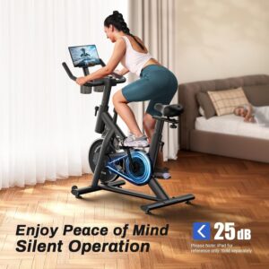 Woman riding smart exercise bike in living room.