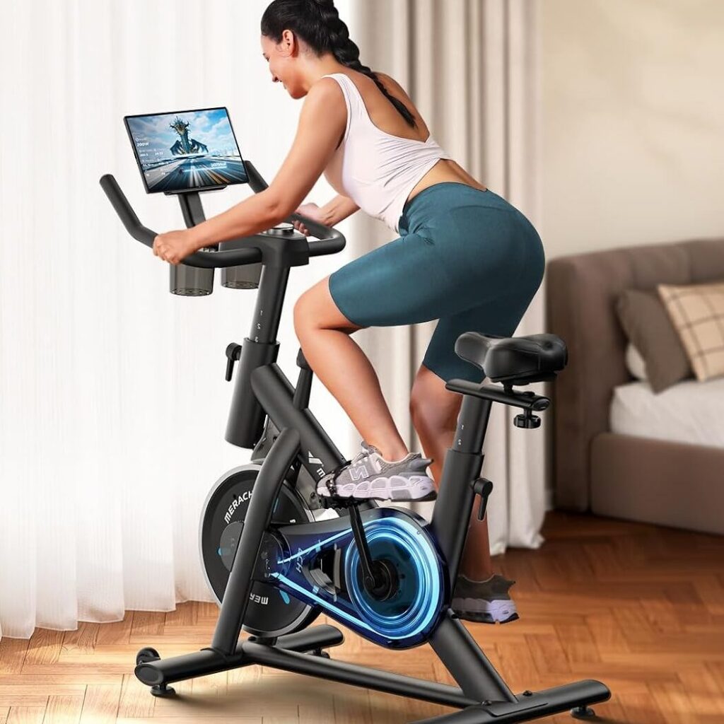 Woman cycling on a smart spin bike inside her home gym living room
