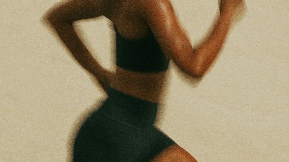 Woman running as part of different types of cardio workouts