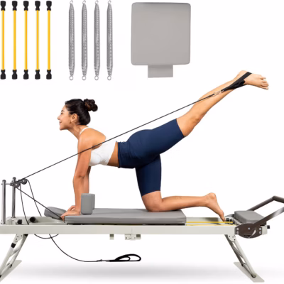 Woman using foldable pilates reformer machine