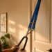 Suspension training system attached to bedroom door and pulled by hands.