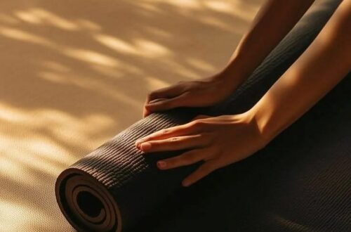 Close up of hands rolling up Yoga mat