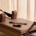Closeup of Pilates Reformer machine with accessories on top